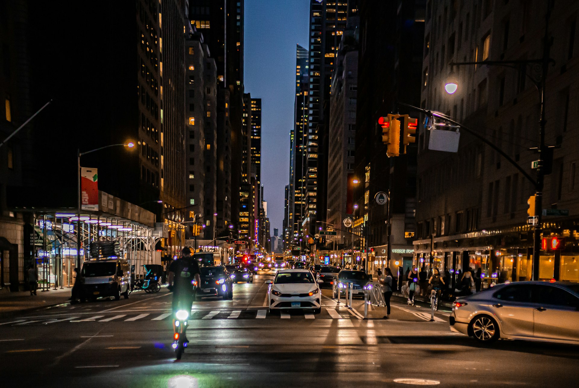 Aerial view of a New York City avenue at night with light traffic from a high vantage point